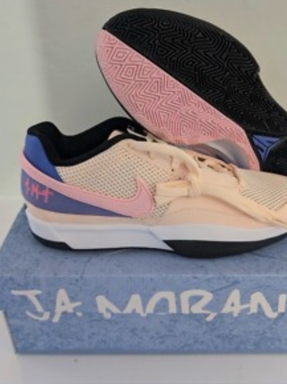 Nike Peach and Pink Low-Top Sneakers with Blue Heel Accents